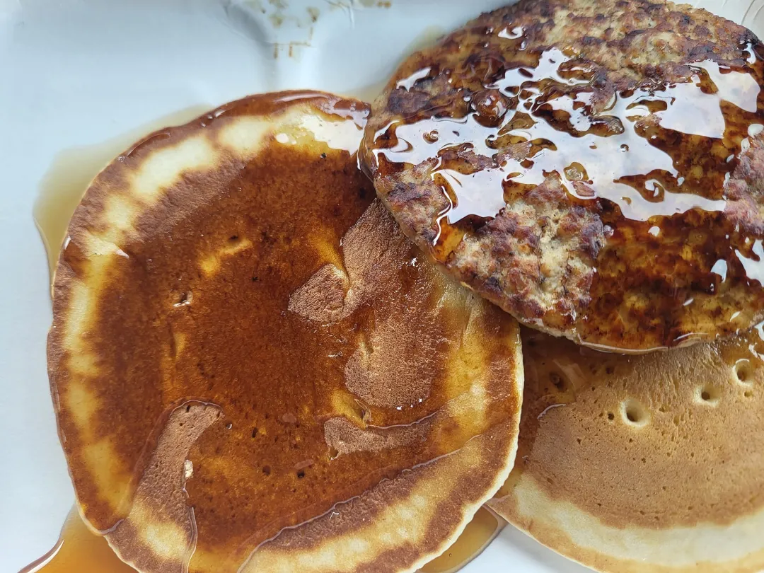Photo from Jayne's Baby Bank (main page), 8 Dec 2023: No one ever told me you could have sausage with your pancakes! I feel like I'm owed 40 years of sausage patties!
