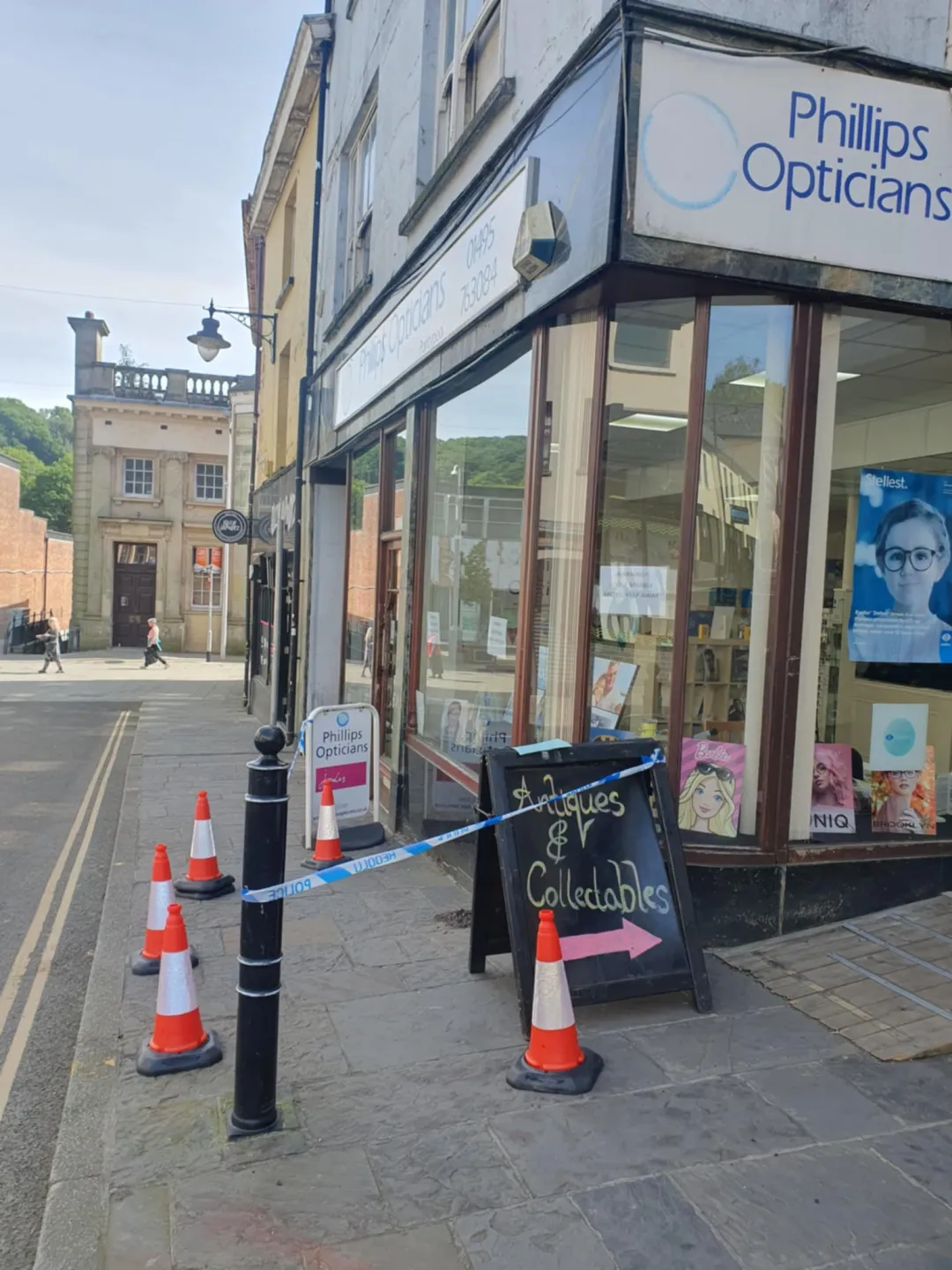 Photo from Jayne's Baby Bank (main page), 15 May 2025: Pmsl! The opticians sign is falling off! We have not been arrested! Hahaha me and Eli were going to stage this last week and have crime scen