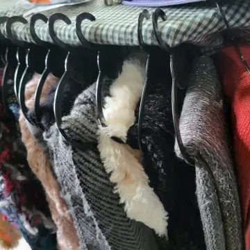 Image from Jayne's Baby Bank (main page), 15 Sep 2024: My parents have been busy hanging and sorting winter accessories. Volunteers keep the hangers please.