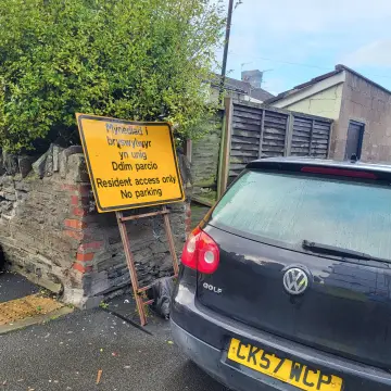 Image from Jayne's Baby Bank (Main Historical Profile), 28 Nov 2025: Two cars blocking lane. They will be clamped they already have tickets on them and next door can't get their delivery driver car out and the