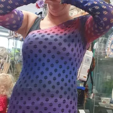 Image from Jayne's Baby Bank (main page), 19 Aug 2025: One or our lovely customers modelling an outfit from the rave/festival section. Me and her friend had a good old laugh - they came in for fa