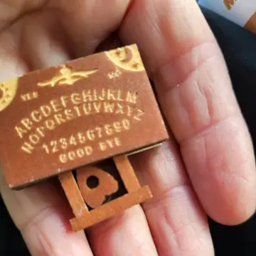 Image from Jayne's Baby Bank (main page), 5 Oct 2025: This is what I've taken this week out of my volunteer allowance- a miniature ouija board for my haunted attic of my giant dolls house. ❤️♻️😍